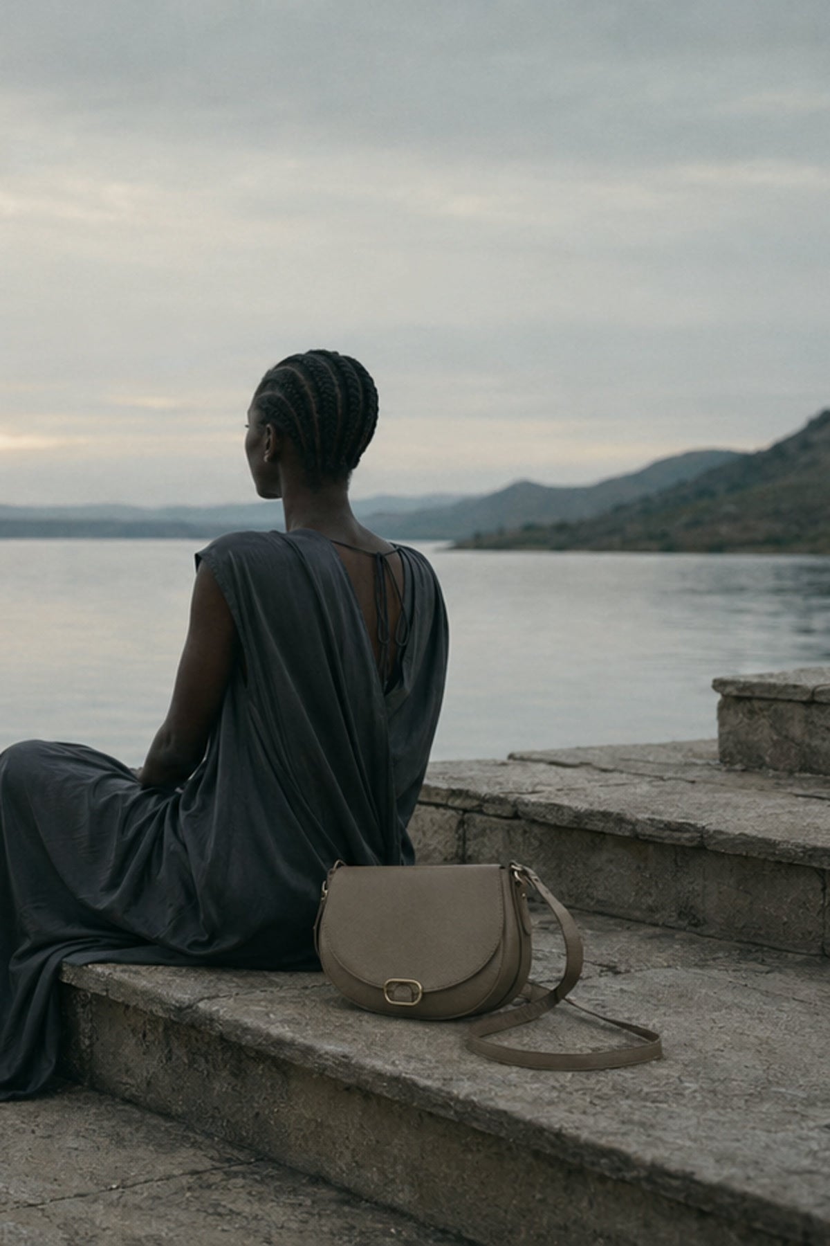AELA editorial campaign model holding a leather handbag